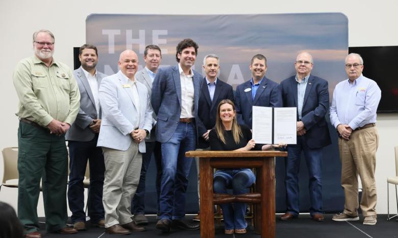 An event was held in Mena to mark the permit signing for the Trails at Mena. Photo by Nelson Chenault. 